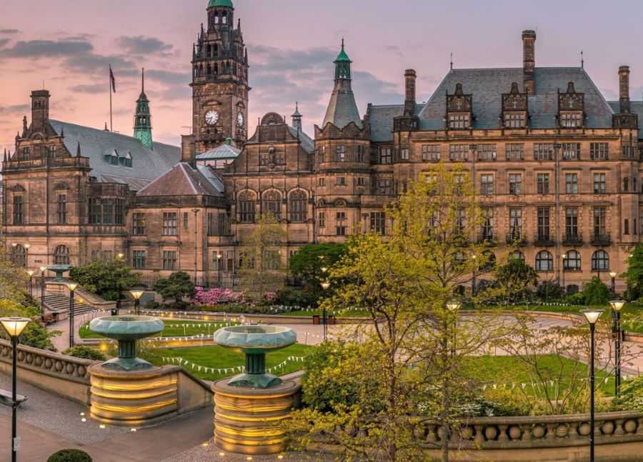Sheffield Town Hall at Sunset With Street Lights Turned on and Bunting in the Garden