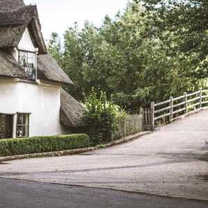 Old House in Countryside Next to Bridge