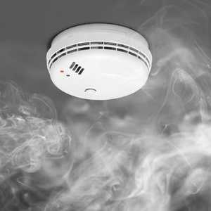 Smoke Rising Towards Smoke Alarm