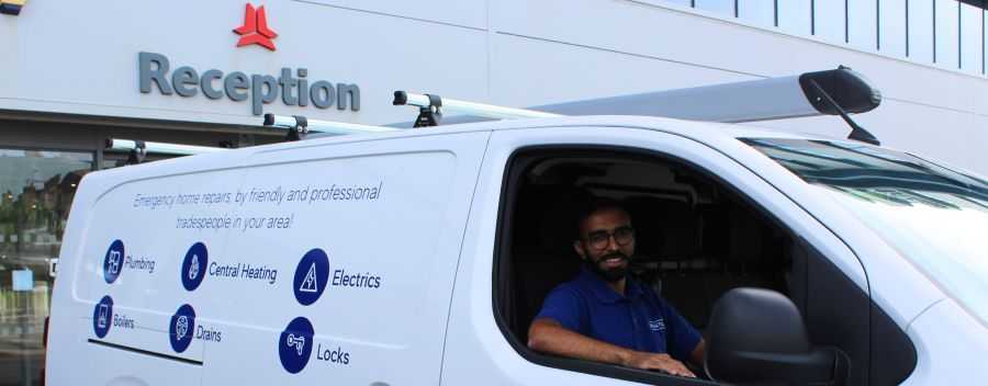 An Engineer Sat in a Rightio Branded Van in a Rightio Uniform