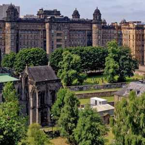 Establishing Shot of Glasgow Cathedral and Surrounding Buildings and Greenery