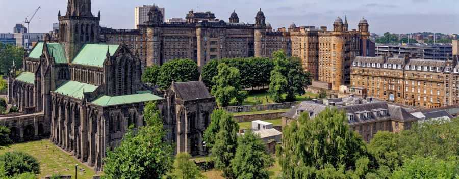 Establishing Shot of Glasgow Cathedral and Surrounding Buildings and Greenery