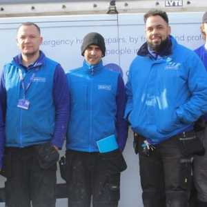 Group of Male Engineers Stood in Front of a Rightio Branded Van All Wearing Rightio Uniform